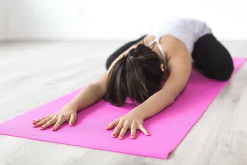 Woman stretching as part of a hormonal wellness routine